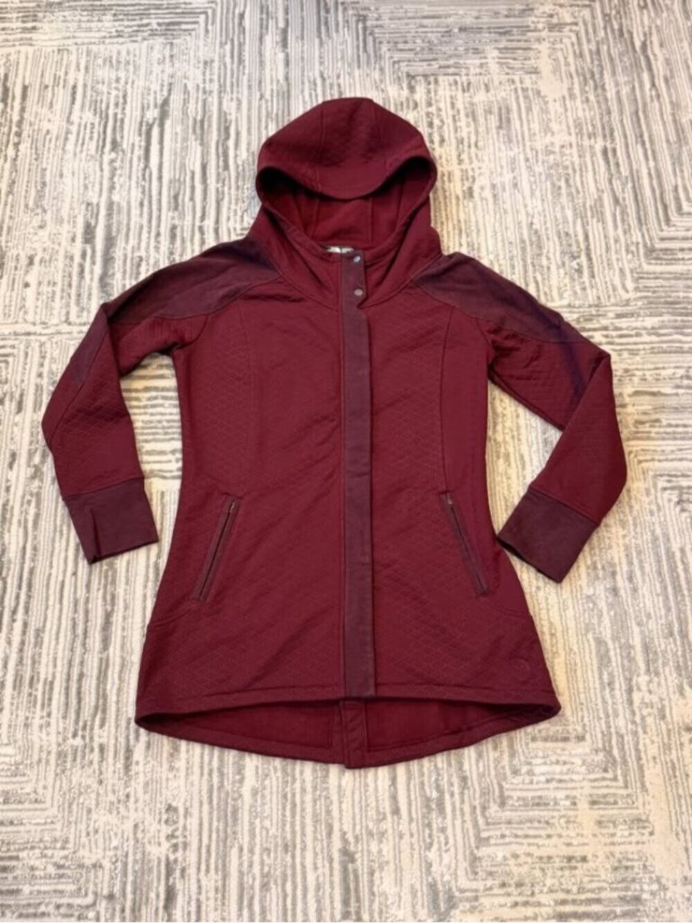 The North Face women's medium Burgundy 3/4 length coat. MSRP $225